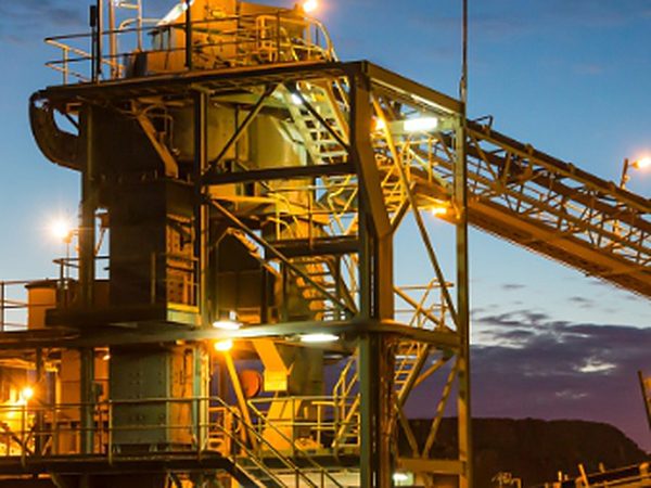 Mineral processing plant lit up at dusk